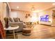 Bright living room features a stylish couch, modern decor, and a large-screen television at 2043 Sombrero Dr, Las Vegas, NV 89169