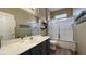 Bathroom with tiled floors, vanity, and shower over tub at 2050 W Warm Springs Rd # 4211, Henderson, NV 89014