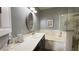 Bathroom featuring dual sinks with a soaking tub and separate glass-enclosed shower at 2050 W Warm Springs Rd # 4211, Henderson, NV 89014