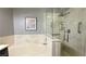 Bright bathroom with walk-in shower, soaking tub with marble surround at 2050 W Warm Springs Rd # 4211, Henderson, NV 89014