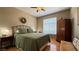 Cozy bedroom with wood floors, comfortable bed, and natural light at 2050 W Warm Springs Rd # 4211, Henderson, NV 89014