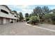 View of a multi-unit building featuring private garages and well-maintained landscaping at 2050 W Warm Springs Rd # 4211, Henderson, NV 89014