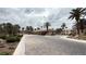 Inviting community entrance with lush landscaping and a guardhouse, providing security and a welcoming atmosphere at 2050 W Warm Springs Rd # 4211, Henderson, NV 89014