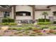 Elegant signage 'Resort Villas' amid landscaped grounds, complemented by lush greenery and manicured shrubs at 2050 W Warm Springs Rd # 4211, Henderson, NV 89014