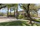 Stunning single-story home with a lush front yard, mature trees, and circular driveway at 2050 W Warm Springs Rd # 4211, Henderson, NV 89014
