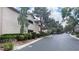 Attractive multi-story building exteriors feature neat shrubs, mulch landscaping, and paved street at 2050 W Warm Springs Rd # 4211, Henderson, NV 89014