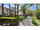 Well-manicured lawn with mature palm trees and lush landscaping near building at 2050 W Warm Springs Rd # 4211, Henderson, NV 89014