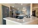 Modern kitchen showcasing granite countertops, blue cabinets, and stainless steel appliances at 2050 W Warm Springs Rd # 4211, Henderson, NV 89014