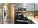 Kitchen featuring stainless steel refrigerator and oven, plus stylish blue cabinetry at 2050 W Warm Springs Rd # 4211, Henderson, NV 89014