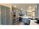 Stylish kitchen featuring stainless steel appliances, blue cabinets, and modern countertops at 2050 W Warm Springs Rd # 4211, Henderson, NV 89014