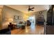 Cozy living room with hardwood floors, fireplace, ceiling fan, and access to the patio at 2050 W Warm Springs Rd # 4211, Henderson, NV 89014