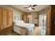 Inviting main bedroom with hardwood floors, walk-in closet, and access to balcony at 2050 W Warm Springs Rd # 4211, Henderson, NV 89014