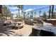 Outdoor kitchen with stone accents, built-in grill, counter space, and picnic tables at 2050 W Warm Springs Rd # 4211, Henderson, NV 89014