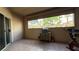 Enclosed patio features neutral tones, large window for natural light, and plenty of room for home workouts at 2050 W Warm Springs Rd # 4211, Henderson, NV 89014