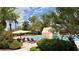 Community pool area with lounge chairs and palm trees at 2050 W Warm Springs Rd # 4211, Henderson, NV 89014