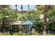 A glimpse of the pool through the trees, offering a refreshing escape at 2050 W Warm Springs Rd # 4211, Henderson, NV 89014