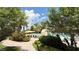 Community pool area with lounge chairs and palm trees at 2050 W Warm Springs Rd # 4211, Henderson, NV 89014