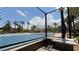 Outdoor tennis court surrounded by a fence with palm trees in the background at 2050 W Warm Springs Rd # 4211, Henderson, NV 89014