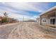 Exterior view showcasing the backyard with a patio and surrounding desert landscape at 2071 Idaho St, Pahrump, NV 89048
