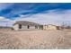 Spacious backyard featuring a covered patio, perfect for outdoor living and entertaining at 2071 Idaho St, Pahrump, NV 89048