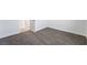 Neutral bedroom featuring soft carpet, white walls, and door leading to another room at 2071 Idaho St, Pahrump, NV 89048