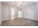 Large bedroom with neutral carpet and views to both an attached bathroom and walk-in closet at 2071 Idaho St, Pahrump, NV 89048