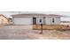 Charming single-story home with a two-car garage and desert landscaping at 2071 Idaho St, Pahrump, NV 89048