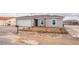 Charming single-story home with a two-car garage and desert landscaping at 2071 Idaho St, Pahrump, NV 89048