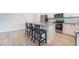 Modern kitchen with an island, stainless steel appliances, and stylish barstool seating at 2071 Idaho St, Pahrump, NV 89048