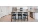 Modern kitchen with an island, stainless steel appliances, and stylish barstool seating at 2071 Idaho St, Pahrump, NV 89048