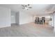 Spacious living room featuring wood floors, natural light and modern ceiling fan at 2071 Idaho St, Pahrump, NV 89048