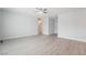 Spacious living room featuring wood floors, natural light and modern ceiling fan at 2071 Idaho St, Pahrump, NV 89048
