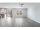 Spacious living room featuring wood floors, natural light and modern ceiling fan at 2071 Idaho St, Pahrump, NV 89048