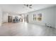 Spacious living room featuring wood floors, natural light and modern ceiling fan at 2071 Idaho St, Pahrump, NV 89048