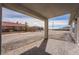 Covered patio with brick flooring offering views of expansive backyard at 2071 Idaho St, Pahrump, NV 89048