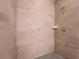 Modern shower with floor-to-ceiling tile and a bench at 2071 Idaho St, Pahrump, NV 89048