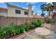 A cozy backyard with lush plants, garden art, and charming outdoor decor at 2124 Rising Mist St, Las Vegas, NV 89134