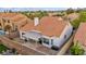 Private backyard featuring a covered patio, well-maintained landscaping and gravel, enclosed by a secure fence at 2124 Rising Mist St, Las Vegas, NV 89134