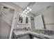 Modern bathroom features sleek countertop, mirror, modern light fixture, and under-sink cabinets at 2124 Rising Mist St, Las Vegas, NV 89134