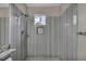 Modern bathroom boasts stylish gray tile, glass shower, and a convenient, space-saving design at 2124 Rising Mist St, Las Vegas, NV 89134