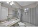 Modern bathroom with a glass shower, granite vanity, and contemporary design at 2124 Rising Mist St, Las Vegas, NV 89134