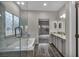 Bathroom showcasing a soaking tub, shower, granite countertops, and wood-look plank flooring at 2124 Rising Mist St, Las Vegas, NV 89134