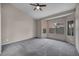 Spacious bedroom with large windows, neutral walls, and plush carpeting at 2124 Rising Mist St, Las Vegas, NV 89134