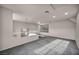 Upstairs bonus room with carpet flooring and ample room for relaxing or entertaining at 2124 Rising Mist St, Las Vegas, NV 89134