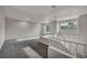 Spacious bonus room with carpet flooring, a modern pendant light, and lots of natural light at 2124 Rising Mist St, Las Vegas, NV 89134