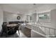 Expansive bonus room setup includes a pool table, dartboard, and game table for entertainment at 2124 Rising Mist St, Las Vegas, NV 89134