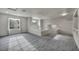 Spacious upstairs bonus room offering large windows, carpet flooring, and neutral paint at 2124 Rising Mist St, Las Vegas, NV 89134