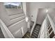 Bright entryway with a view of the open staircase, large windows, and a modern light fixture at 2124 Rising Mist St, Las Vegas, NV 89134
