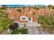 Charming two-story home with a beautiful clay tile roof, well-manicured lawn, and a two-car garage at 2124 Rising Mist St, Las Vegas, NV 89134