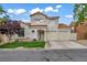 Charming two-story home features a terracotta roof, stucco facade, and a well-manicured front yard at 2124 Rising Mist St, Las Vegas, NV 89134